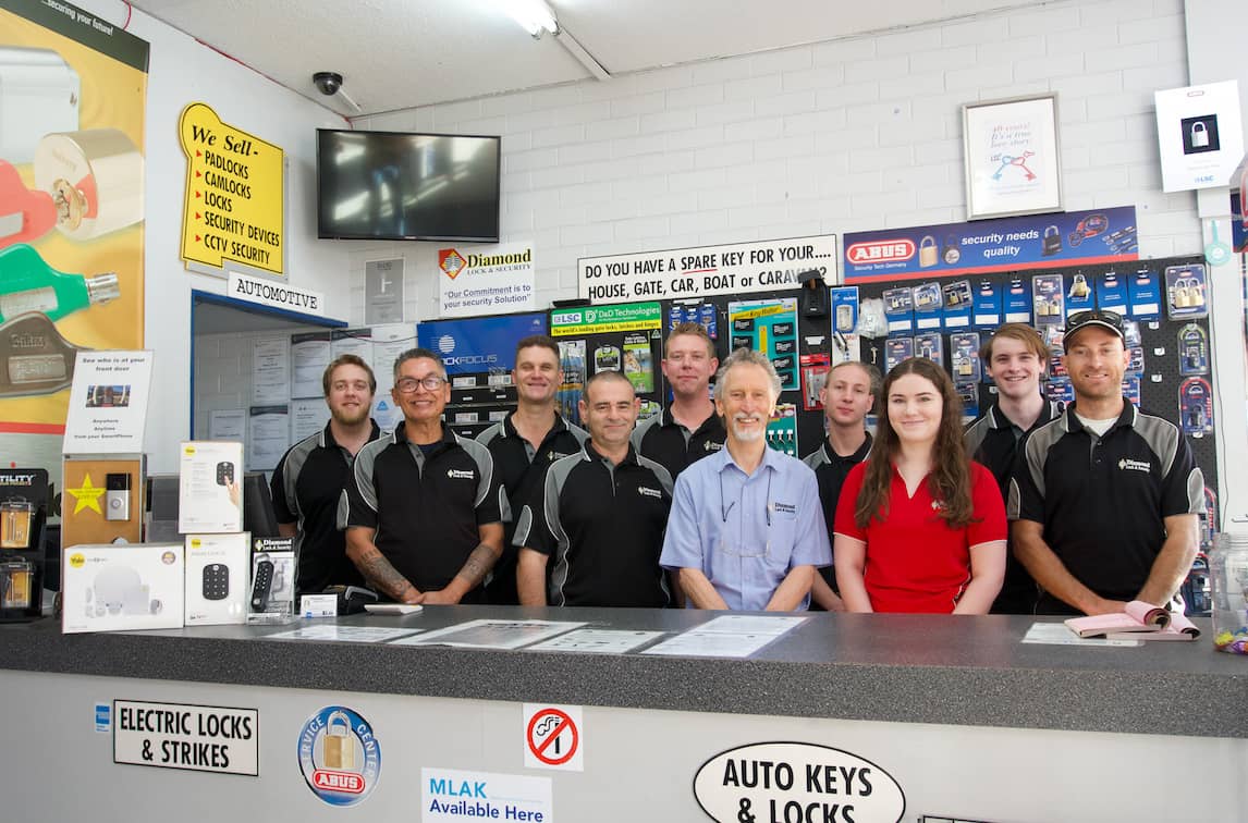 The team of licenced professionals at diamond security standing behind the counter. The team of licenced professionals at diamond security standing behind the counter.
