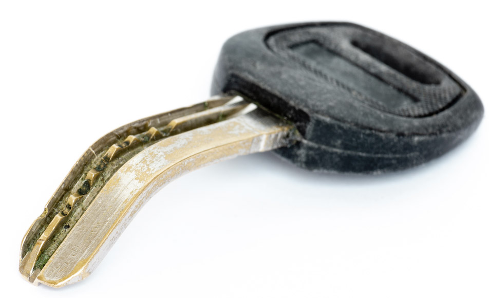 A bent car key as a result of improper use.