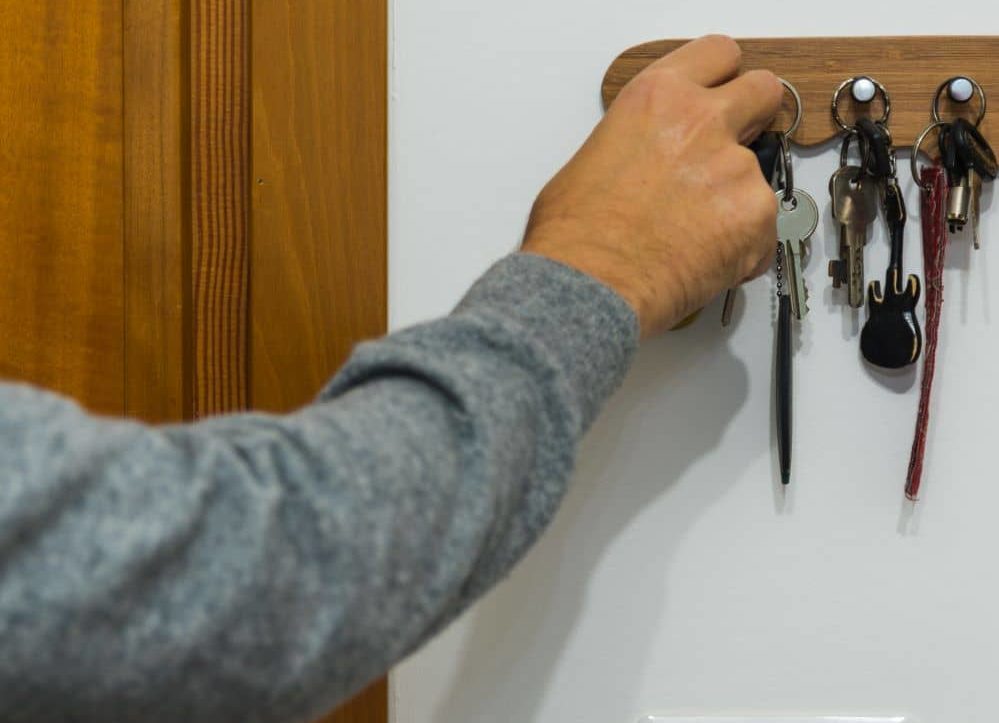 Man grabbing his keys before going out.