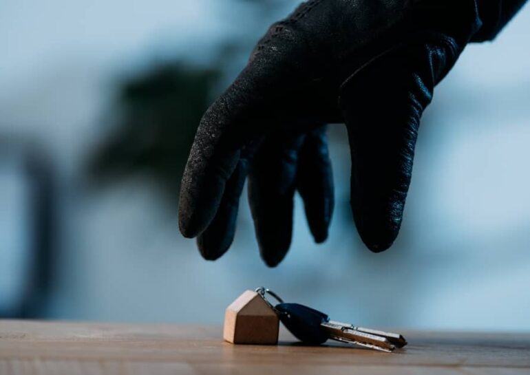 a thief picking up a pair of keys